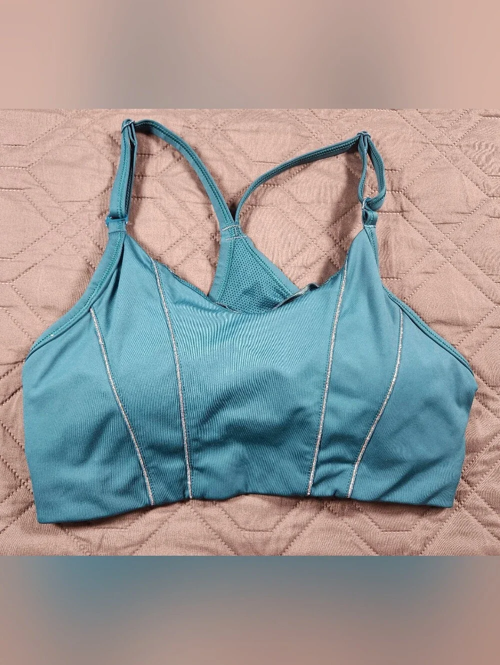 teal Nike Dri-FIT Indy light-support sports bra sparkling metallic tape accents